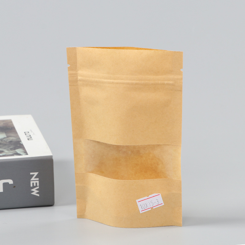 Spot bolsa de papel kraft con ventana transparente bolsa de embalaje de alimentos autosellada autoportante bolsa de té sellada de ocho lados fácil de rasgar