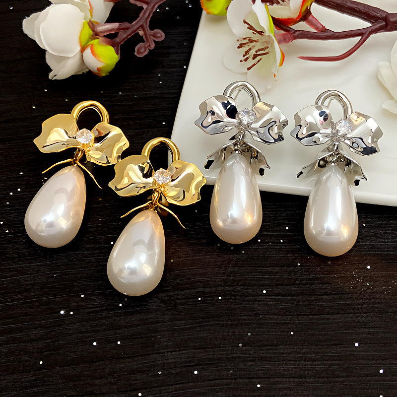 Retro earrings with bow with zircon from pearl