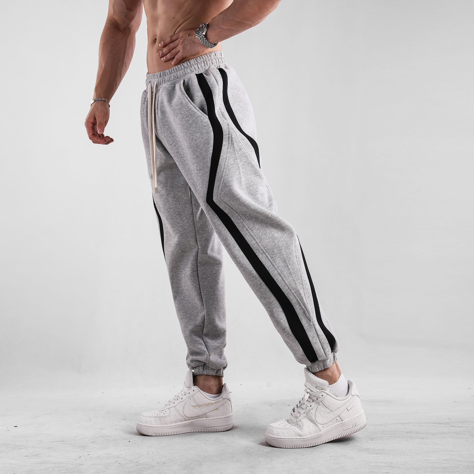 Otoño e Invierno a rayas americano casual deportes europeo y americano más tamaño pantalones sueltos pantalones de chándal muscle hombres deportes nueva moda