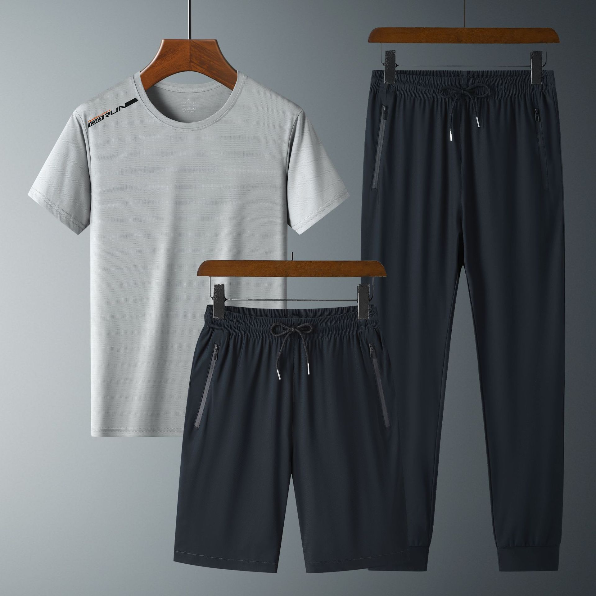 Ropa de verano de secado rápido traje de manga corta deportiva para hombres talla grande Camiseta de seda de hielo pantalones de estudiante traje de tres piezas