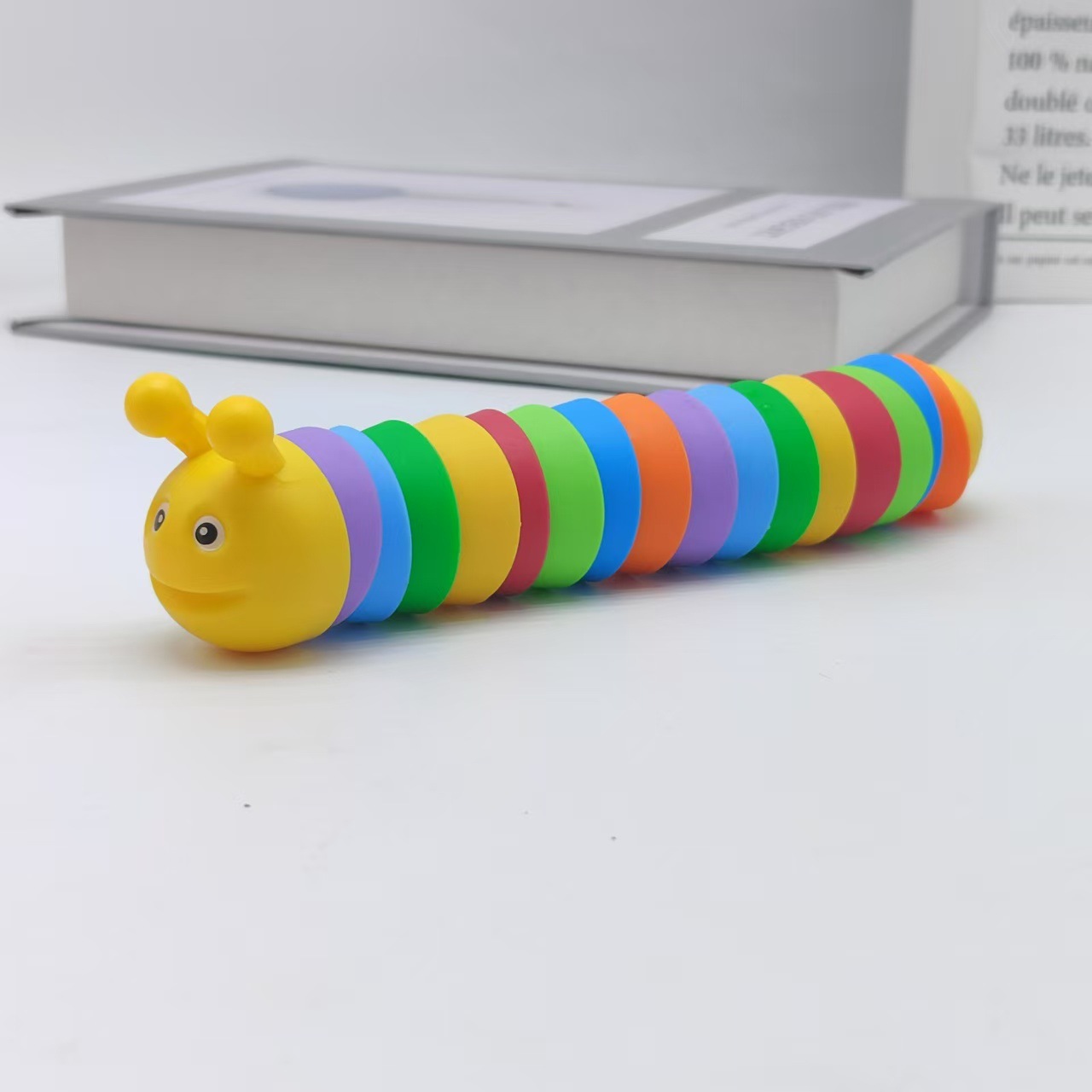 Explosiones transfronterizas simulación descomprimida arco iris sonriente nariz oruga peristáltica puzzles pequeños juguetes para niños animales mayoristas