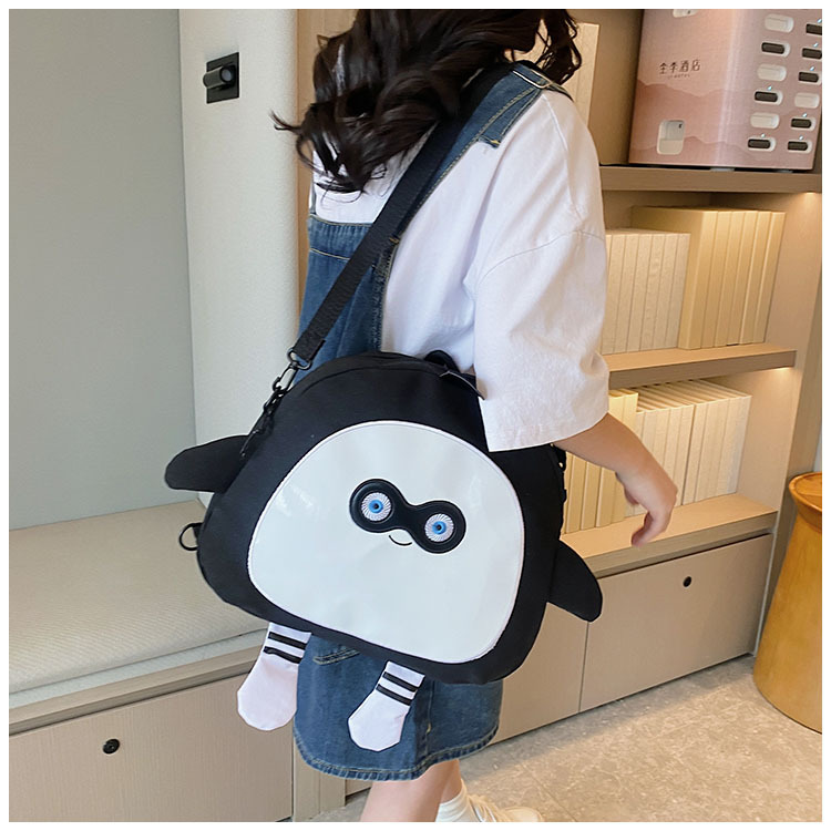 The new 2024 children's egg-shaped party backpack is a cute cartoon canvas single-shoulder bag and a fashionable and stylish small backpack undefined