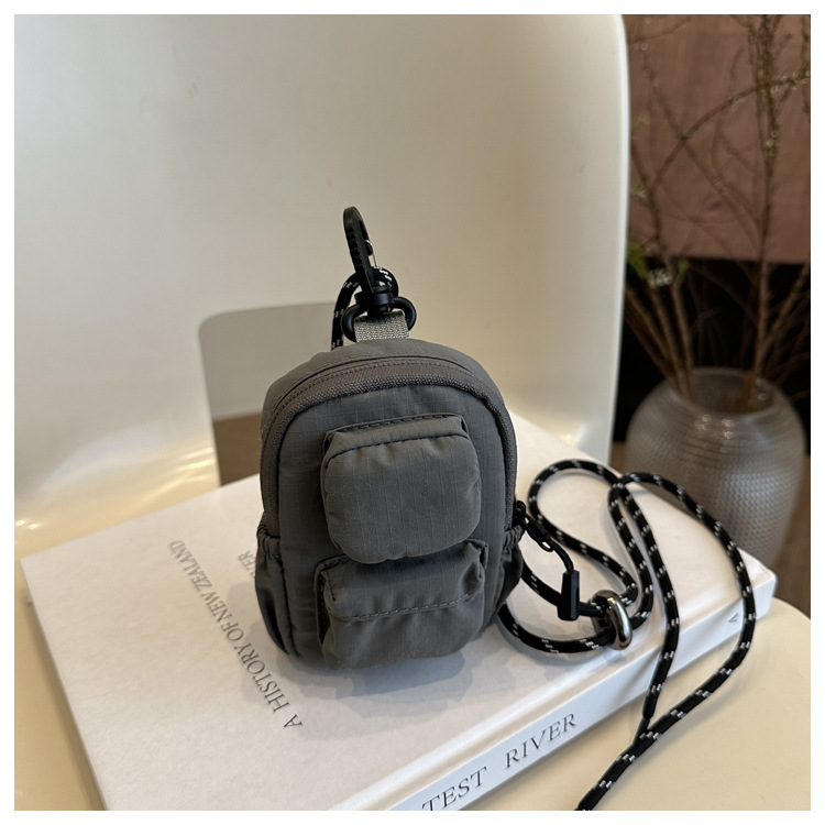 Mini colgante bolso de cambio 2025 nuevo cross-border nylon impermeable bolso de auriculares de bolsillo de hombro