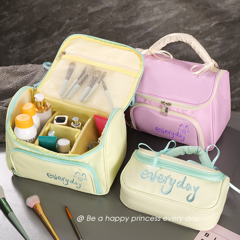 Capacious handheld cosmetic bag with bow to go out