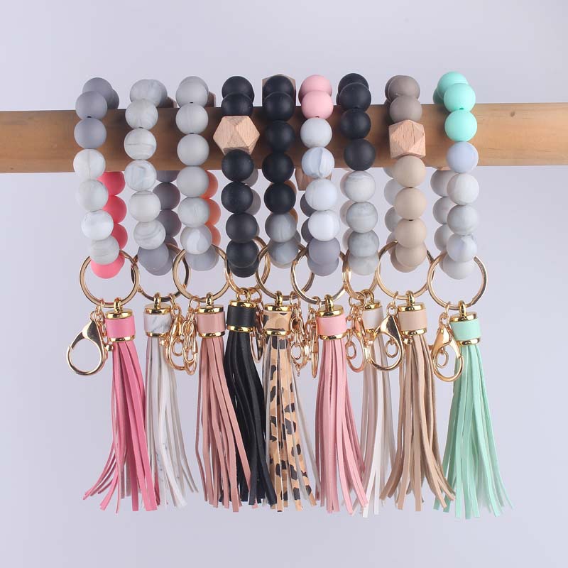 Nuevo cuero creativo pu borla colgante silicona muñeca llavero colgante silicona cuentas pulsera llavero