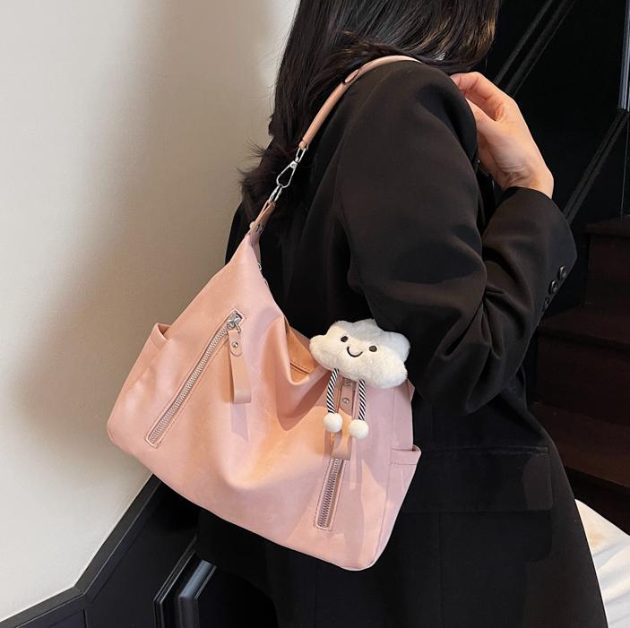 Bolsa suave Pitot para mujeres de gran capacidad 2025 nueva alta sensación de bolso de mano de viaje simple mochila de bolsillo casual