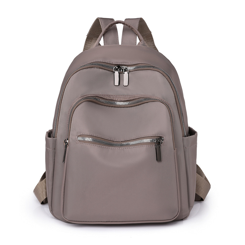 2023 nueva mochila de tela Oxford de color sólido para mujer, arte urbano, viajero, mochila de viaje ligera, mochila escolar al por mayor