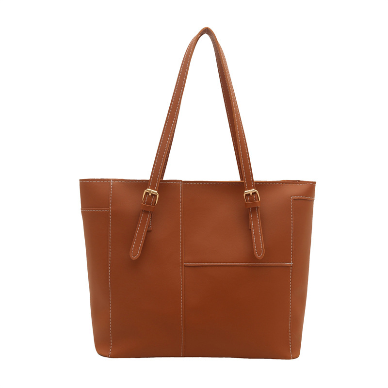 Bolsa de mujer de gran capacidad de textura de viaje de primavera 2025, nuevo bolso de hombro retro empalmado bolso de brazo portátil