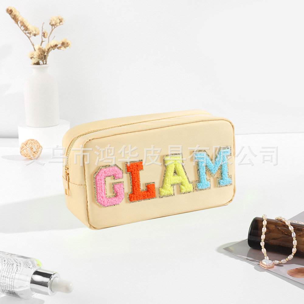 Transfronterizo amazon popular toalla bordada carta de nylon bolsa de cosméticos bolsa de almacenamiento de gran capacidad informal de las mujeres a prueba de agua