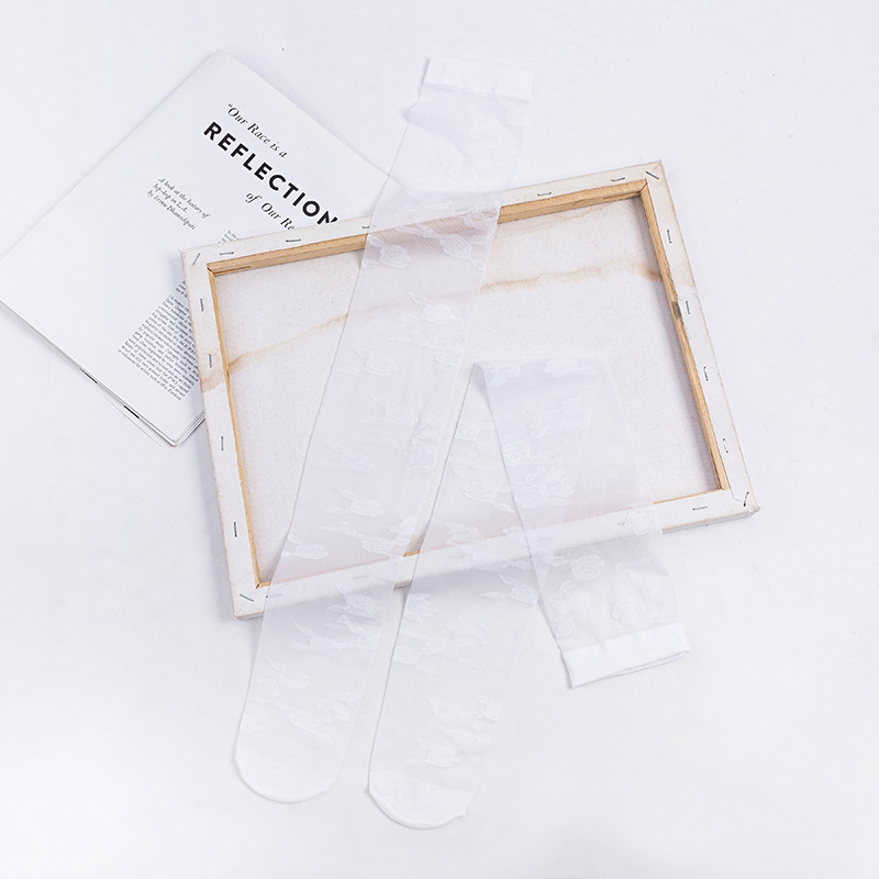 Calcetines por encima de la rodilla de las mujeres ins medias de flores grandes delgadas transparentes estilo JK medias blancas y negras atractivas del color sólido al por mayor