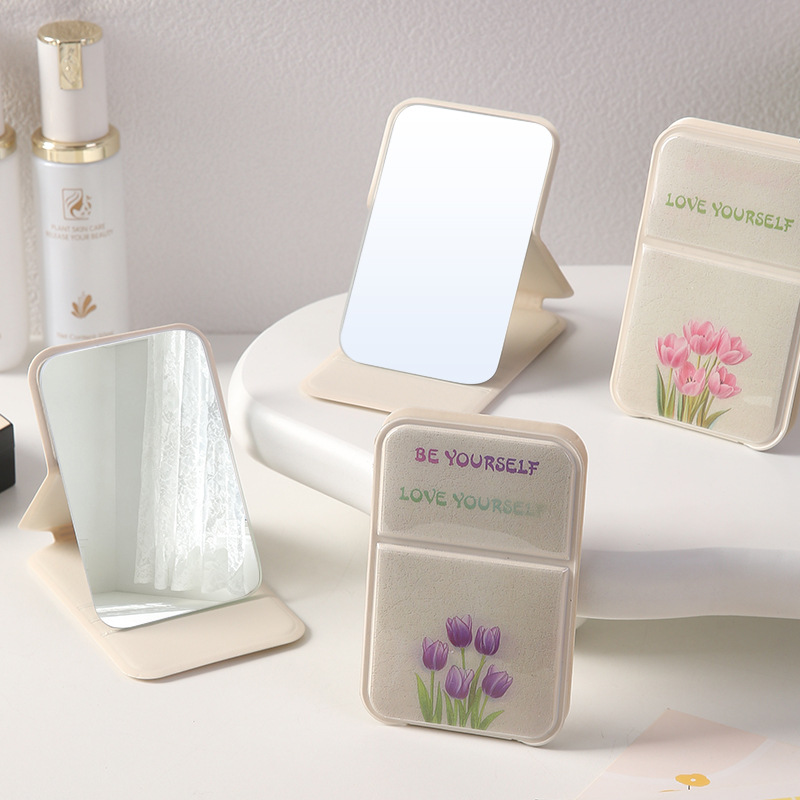 Inswind encantador de alto valor facial espejo de maquillaje espejo plegable pequeño espejo portátil de vestir espejo de estudiantes