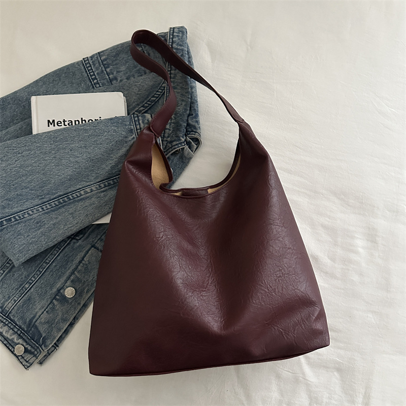 Bolso coreano de invierno para mujeres 2024 bolso de viaje de alta calidad sensación de gran capacidad simple versátil bolso de hombro de cuero suave