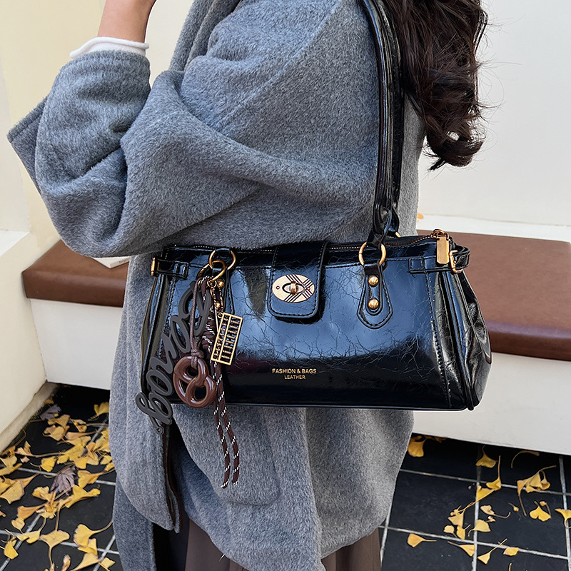 Bolsa de brazo de viaje coreano, bolso de cera retrógrada para mujeres, bolso de palo de piel de aceite 2025, nueva moda versátil bolso de hombro portátil