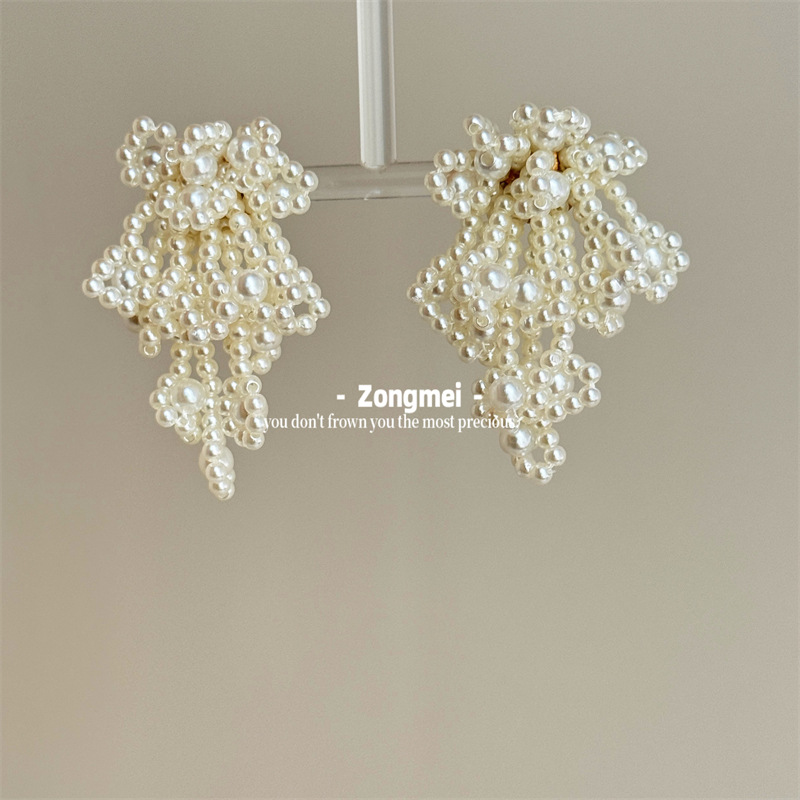 Design woven ear clips pearl with tassels