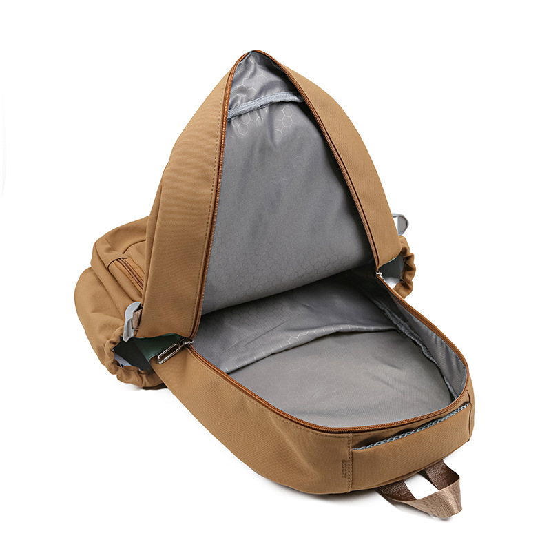 Al por mayor nueva mochila simple, mochila de viaje casual de moda, mochila de gran capacidad para estudiantes de primaria y secundaria para reducir la carga