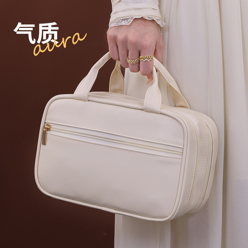 Bolsa de cosméticos de doble capa de lujo ligero 2024 nueva bolsa de almacenamiento de cosméticos portátil de alta calidad almacenamiento de partición de gran capacidad