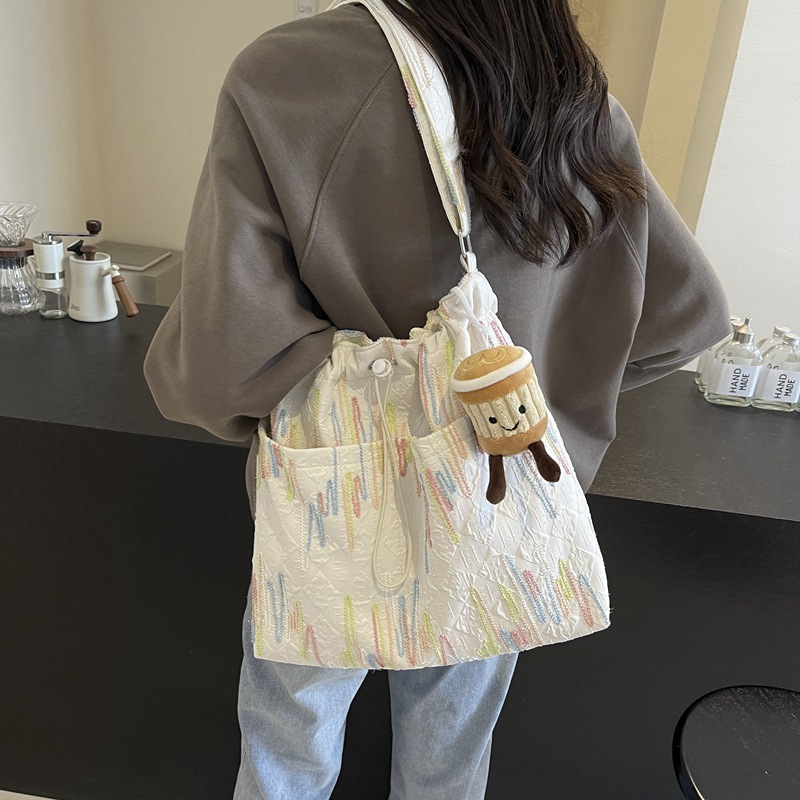 Alto sentido de la bolsa de lona de transporte casual versátil2024 nuevo bolso de mujer de verano popular gran capacidad bolso de cubo