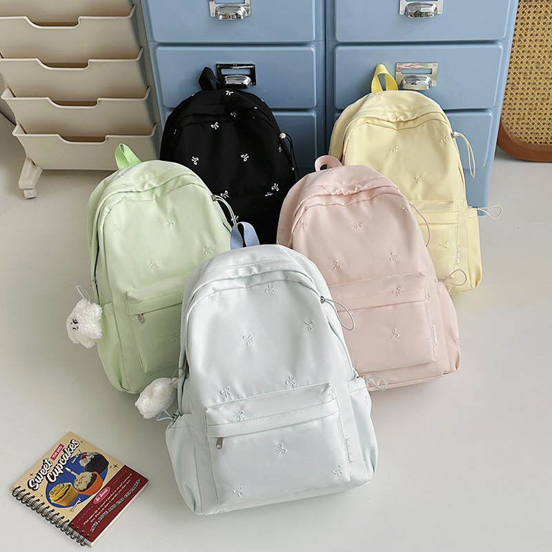 Korean-style fresh student backpack, simple solid color bow backpack, lightweight casual backpack for middle and high school students