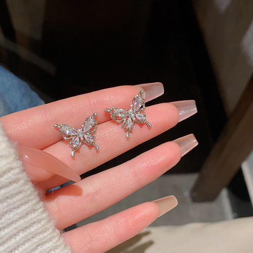 Exquisite zircon butterfly earrings for women S925 silver needles dancing hollow design earrings internet celebrity same style earrings
