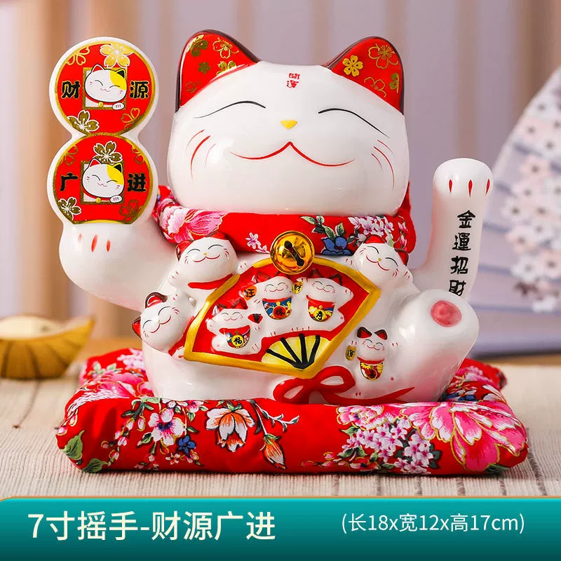 7 -inch wealth cat ornament shakes hands.