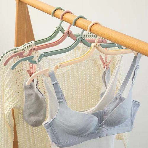 Internet celebrity folding clothes hanger travel portable clothes hanger business trip magic clothes hanger wholesale men and women clothes drying pole 