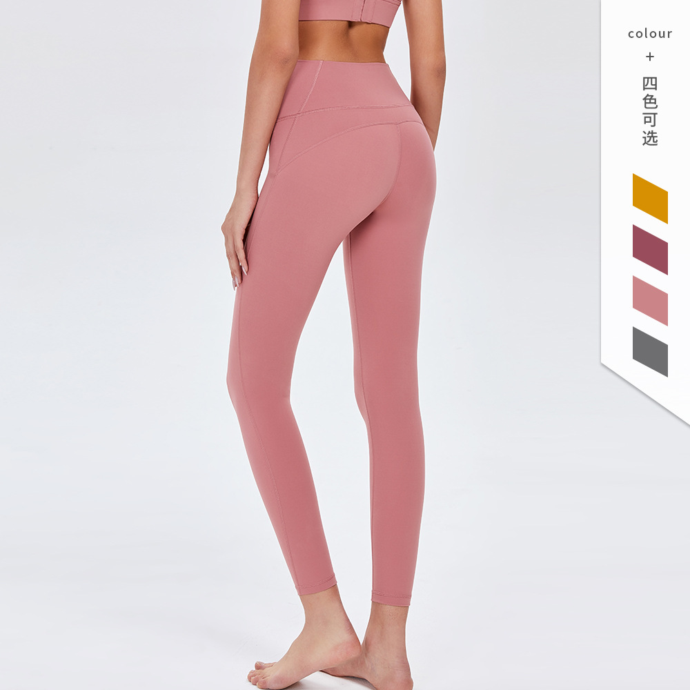 Pantalones de Yoga de cintura alta desnuda europea y americana de las mujeres Peach Hip lifting Pantalones deportivos ajustados pantalones de fitness de secado rápido