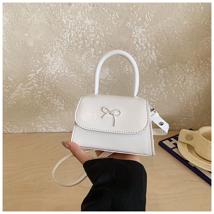 Bolsos infantiles transfronterizos dulces lindos arcos bolsos de mano de niña mini oso colgante bolsos de hombro