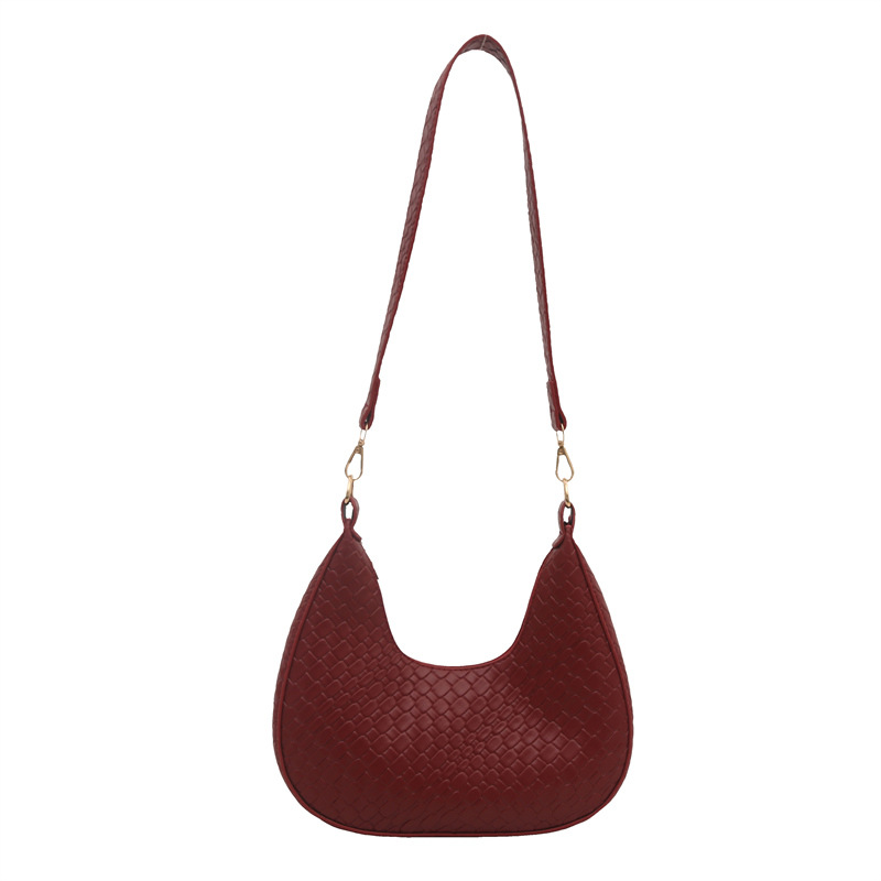 Bolsa de mujer de color sólido 2025, tendencia de primavera, nueva bolsa de brazo coreana tejida, bolso de hombro casual.