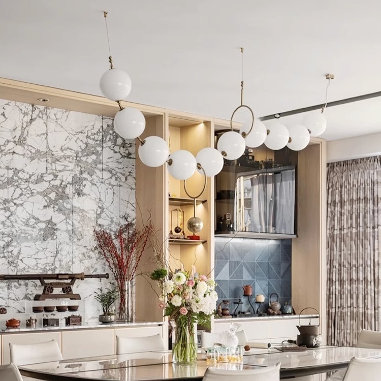 Luz francesa del restaurante de frijoles mágicos moderno simple bronce collar de perlas lámpara de bar largo loft Buda perlas lámpara de bar