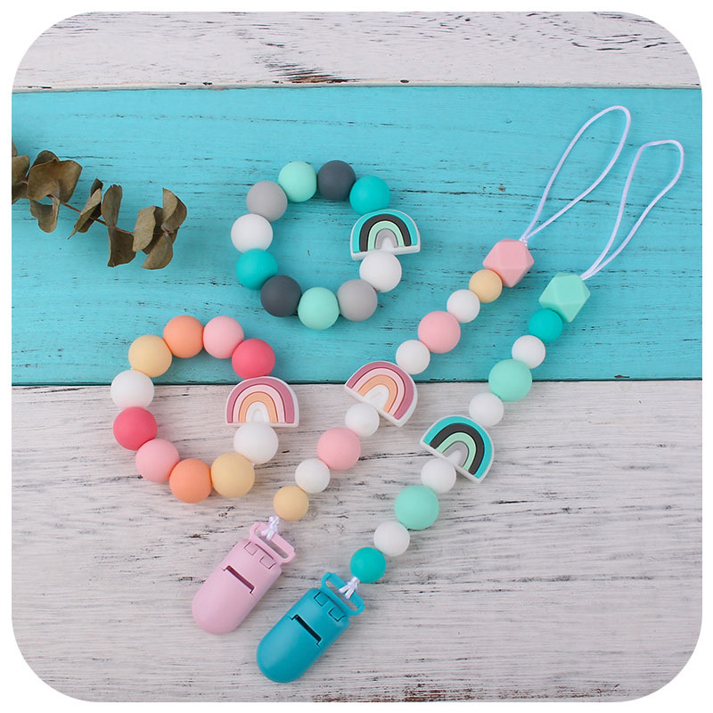 Nuevo bebé de dibujos animados colorido rojo pulsera de silicona teether palo pezón cadena anti-caída cadena juguete teether