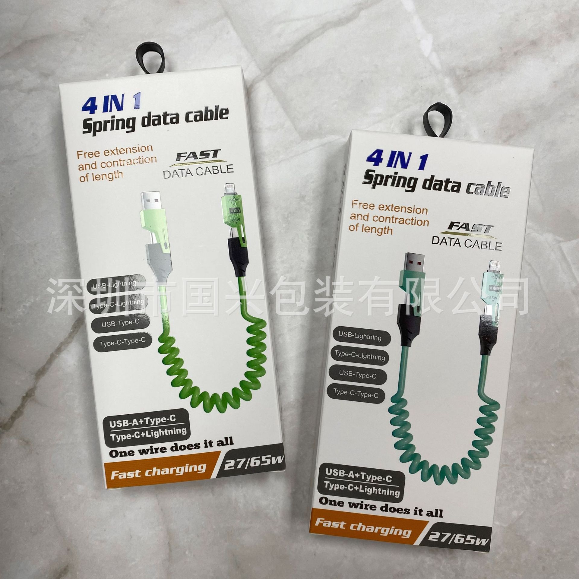 65W resorte telescópico cuatro en uno caja de embalaje de cable de datos neutro cable de datos cargado rápido un arrastre cuatro usb