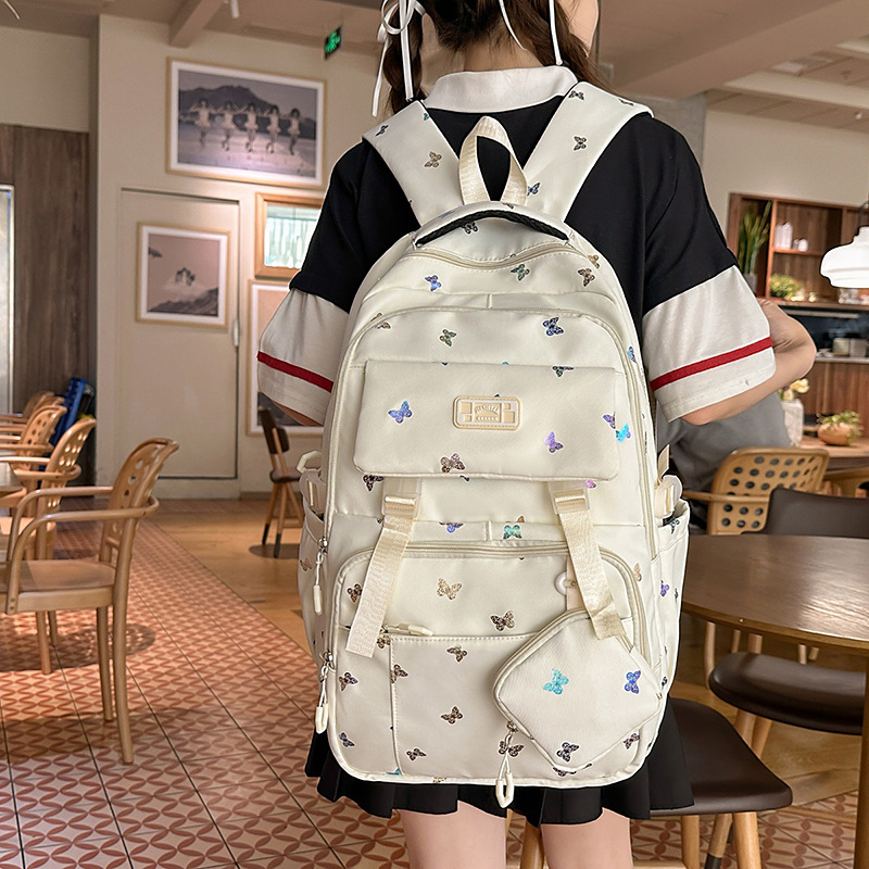Cute mochila de gran capacidad nueva mochila de estudiantes de viajes de secundaria y secundaria de alto valor de la cara mochila de hombro de estudiantes en venta caliente