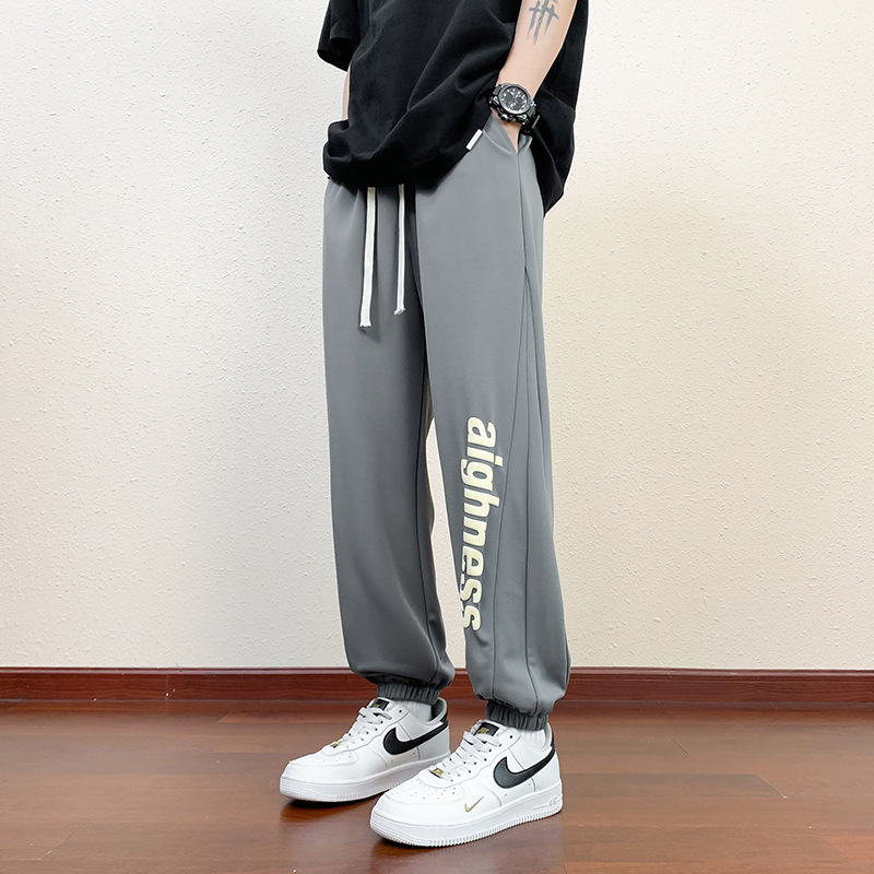 Pantalones cortos deportivos de hielo negro para hombres verano 2024 nueva marca de moda americana suelta rápida secado recto pantalones casuales de cinco puntos