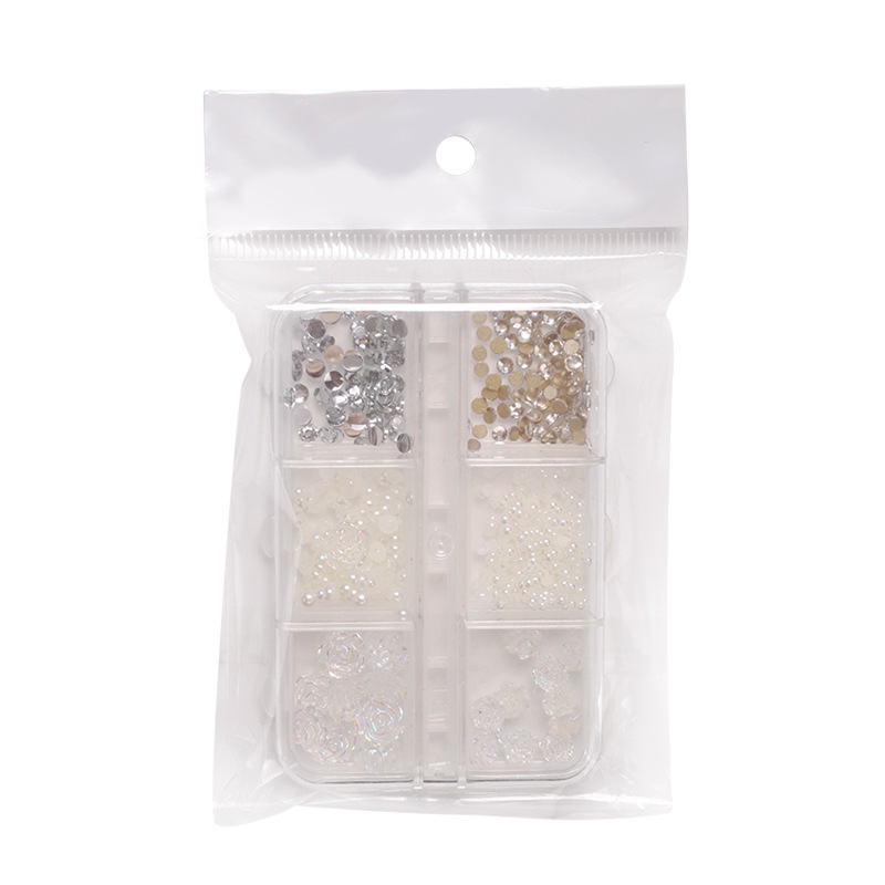 Joyería de uñas Aurora arco perla remache pequeños accesorios Super Flash pequeño diamante 12 rejilla mixta decoración de uñas al por mayor