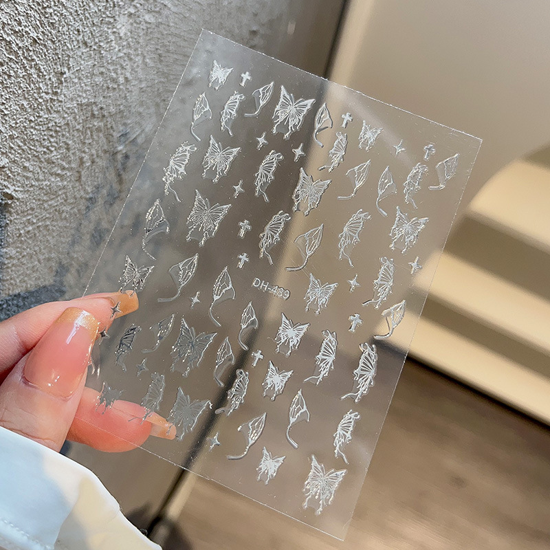 液体の蝶のネイルシールの立体レーザーと金銀の白黒の蝶の薄い靭性帯のゴムを背負って花の爪を貼って卸売りを貼ります。|undefined