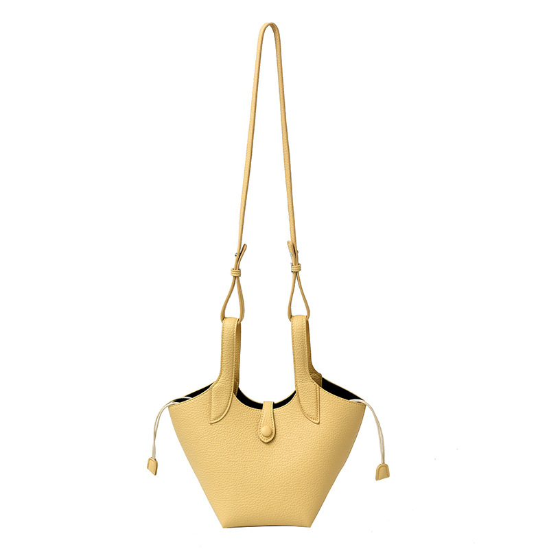 Bolsa de axila de textura de nicho Bolsa de mujer 2025 primavera nuevo bolso de cubo bolso de canasta de mensajero de un solo hombro simple