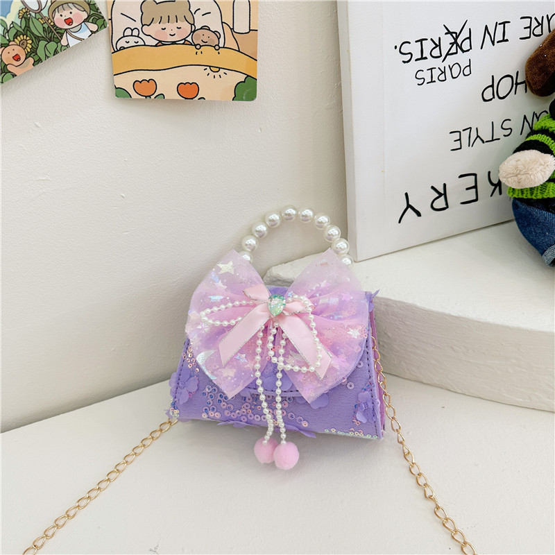 Nueva princesa de dibujos animados bolsos infantiles lindos bolsos de arco de moda chica perla bolsos de hombro