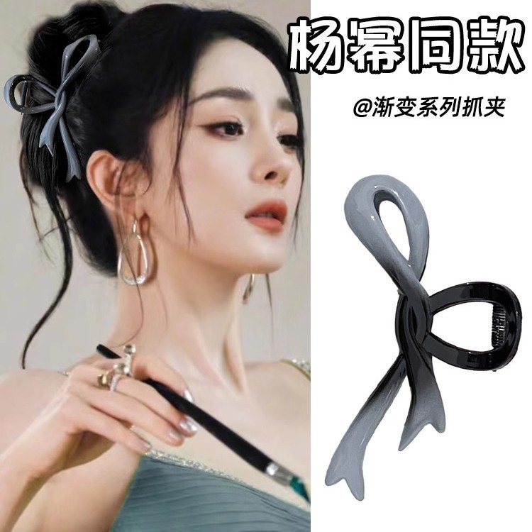 大きいサイズのアクリルの蝶結びは女性の高級感のグラデーション色のアイロンを挟んで後頭部のサメの頭を挟んで飾ります。|undefined