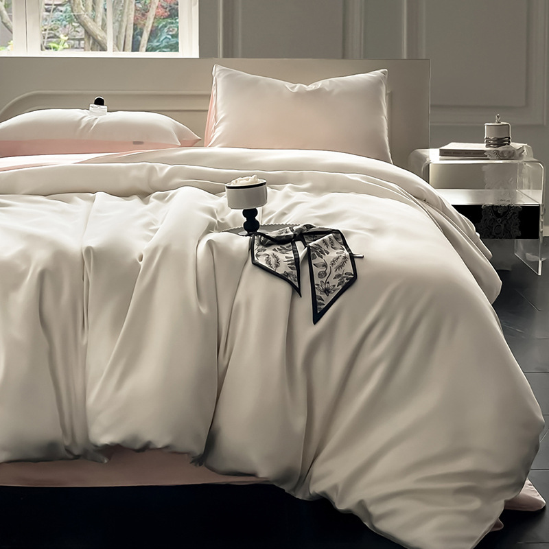 Juego de cama de verano de cuatro piezas de seda de hielo de lujo ligero 2025 nueva funda de edredón sábana sábana sábana ropa de cama desnuda sedosa