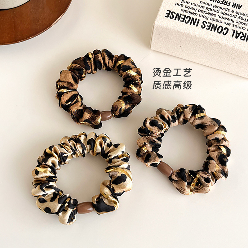 Temperamento europeo y americano estampado leopardo anillo de cabello simple de alta elástica cuerda de cabello gruesa cuerda de cabello de bolas duradera correa