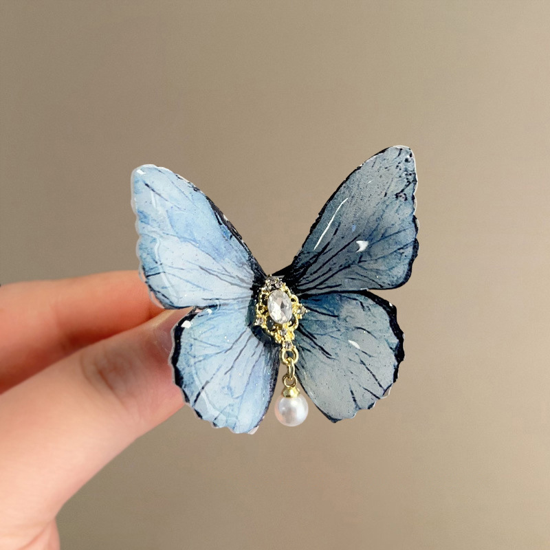 Horquilla de diamantes con incrustaciones de perlas de mariposa Clip de pico de pato lateral simple coreano de alta calidad, fresco y versátil, horquilla, accesorios para el cabello al por mayor