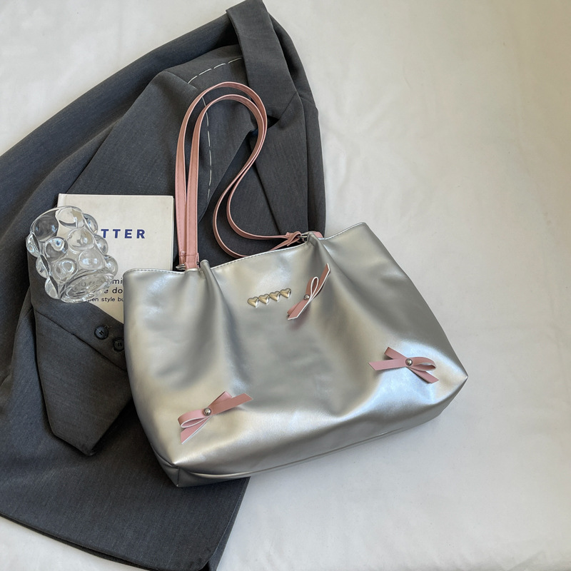 Este año popular bolso de viaje de moda coreana, bolso de hombro de estilo de ballet de mujer, textura alta, arco, bolso de mano.