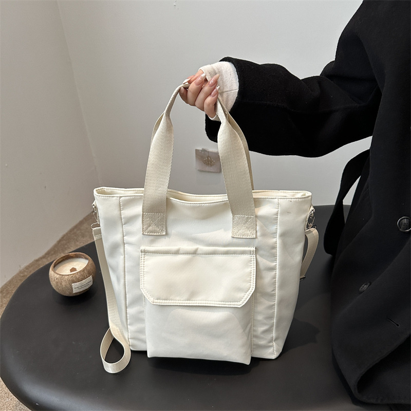 Corea del estilo de transporte universal lona multi-bolsillo TOT estudiantes de arte ocio simple 2025 bolso de hombro portátil