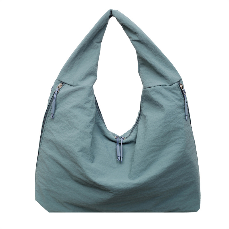 Bolsa de brazo de tela de nylon transfronteriza para mujeres 2025, nueva bolsa de hombro casual simple, bolsa de torneo casual universal