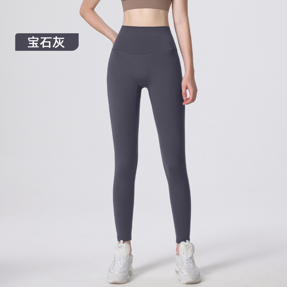 Nuevos deportes de yoga cintura alta desnuda sensación de no vergüenza línea piel-friendly levantamiento de la cadera del vientre que no se contrae la caída de la aptitud de las mujeres pantalones recortados