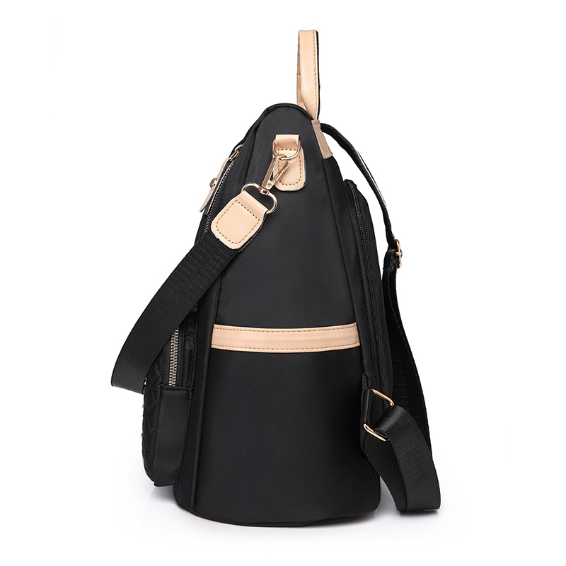 Verano de alto valor nuevas señoras nylon antirrobo mochila de moda remache multifunción mochila de viaje al por mayor marea