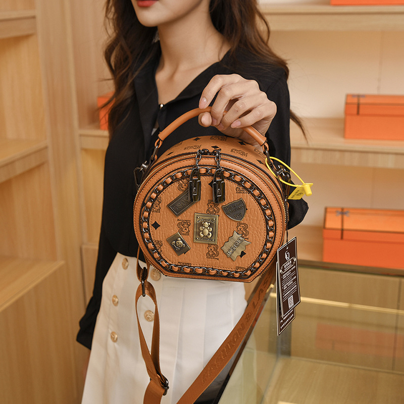 Bolsa de insignia de nicho de alta calidad para mujeres 2023 primavera nueva moda estilo coreano todo partido hombro crossbody pequeña bolsa redonda