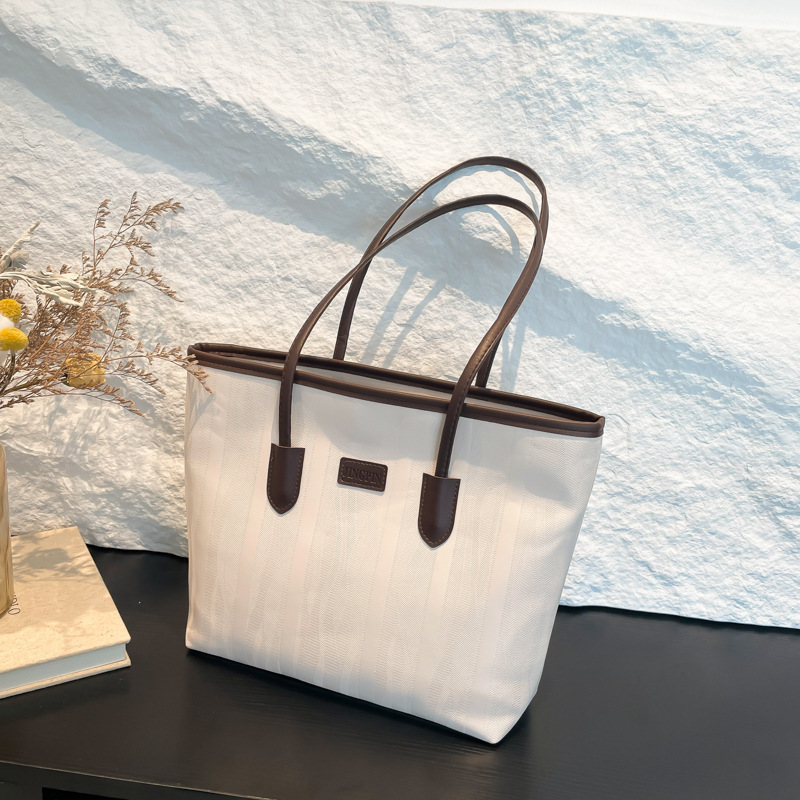 Bolso coreano nicho ZhongTote 2026 nuevo estilo de moda de mujer bolso de hombro de color sólido simple bolso de gran capacidad