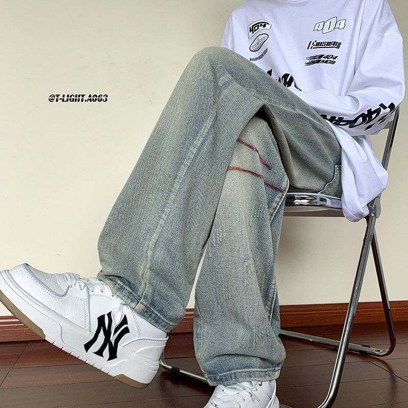 Nuevo producto Trend American White Retro Bordado Scratch Old Jeans Pantalones sueltos Hombres y mujeres Trendy Long