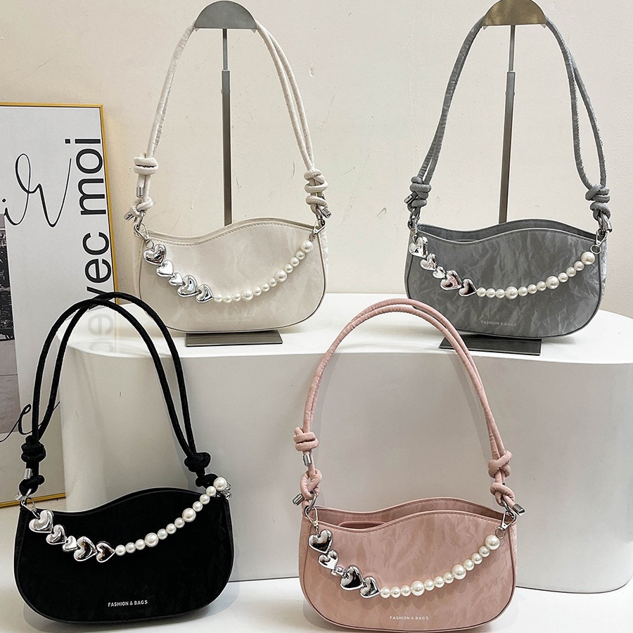 Textura de celebridades de Internet, bolso pequeño de estilo occidental para mujer 2024 verano nuevo bolso de hombro de perlas, bolso de axila de mensajero de moda de todo fósforo